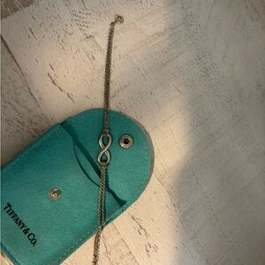 Tiffany & Co. Silver Infinity Bracelet with Teal Pouch